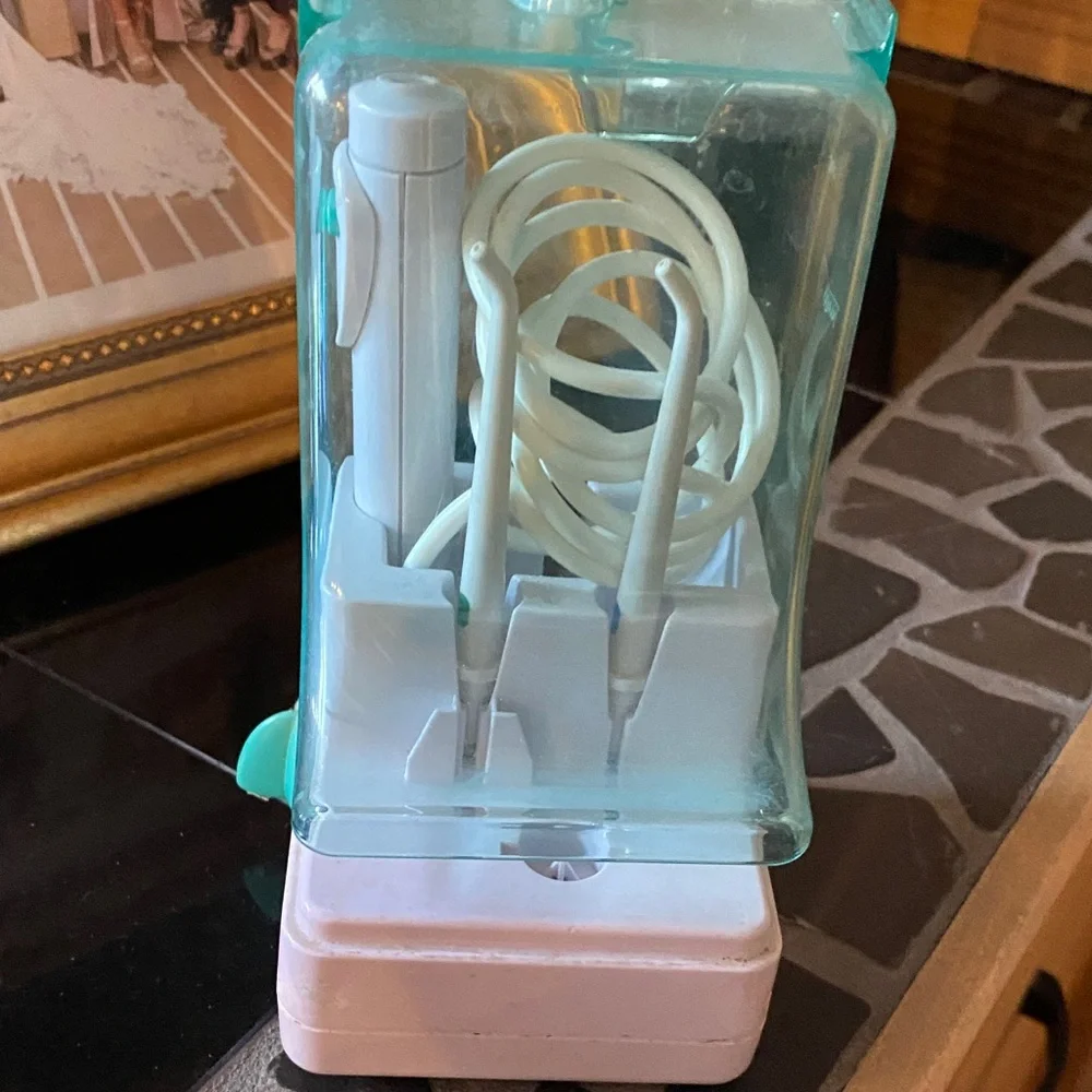 Electric Toothbrush with Aqua and White Design